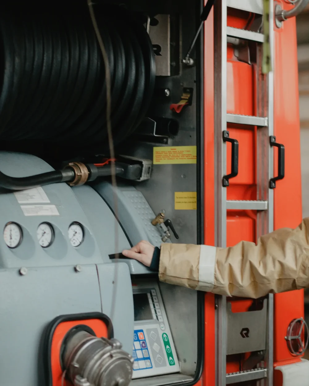 firefighter-operating-pump-controls-inside-fire-tr-2026-09-22-16-50-38-utc